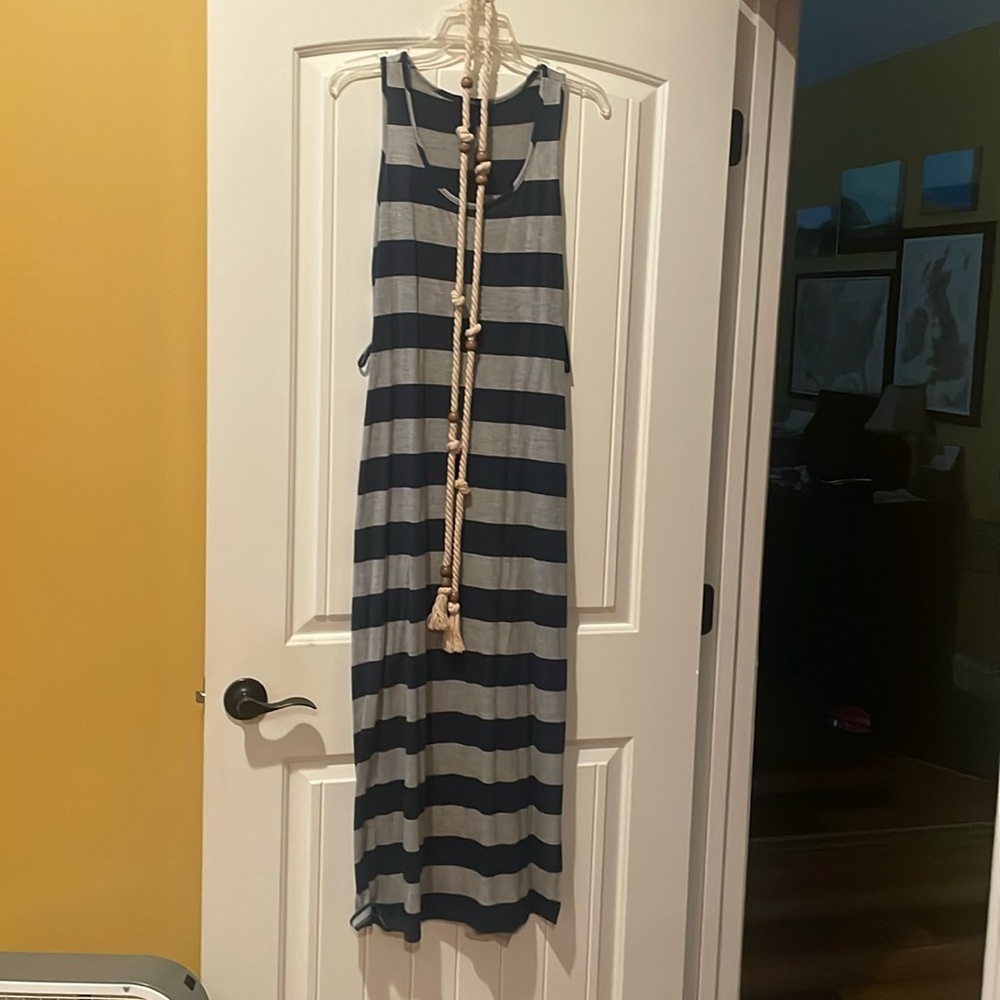 Worn only a few times. Maxi dress with belt. Size not found, but likely medium.